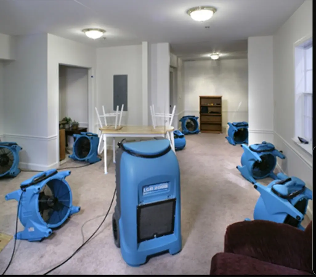 Air movers and dehumidifier setup for Water Damage Restoration in South Holland